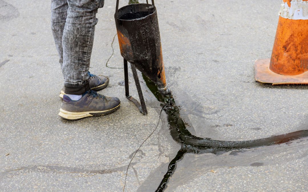 Crack Filling vs. Sealcoating: What Works Best for Your Plan